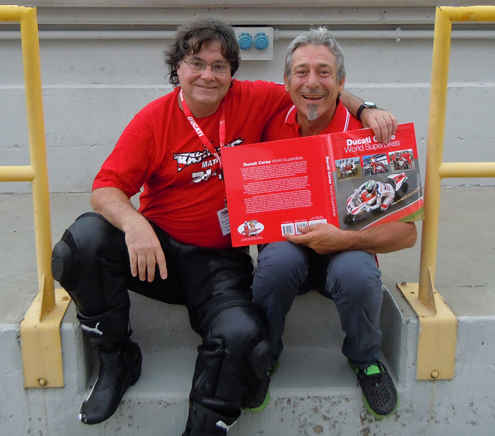 Troy bayliss receives Cucati Corse World Superbikes book from Jim Gianatsis
